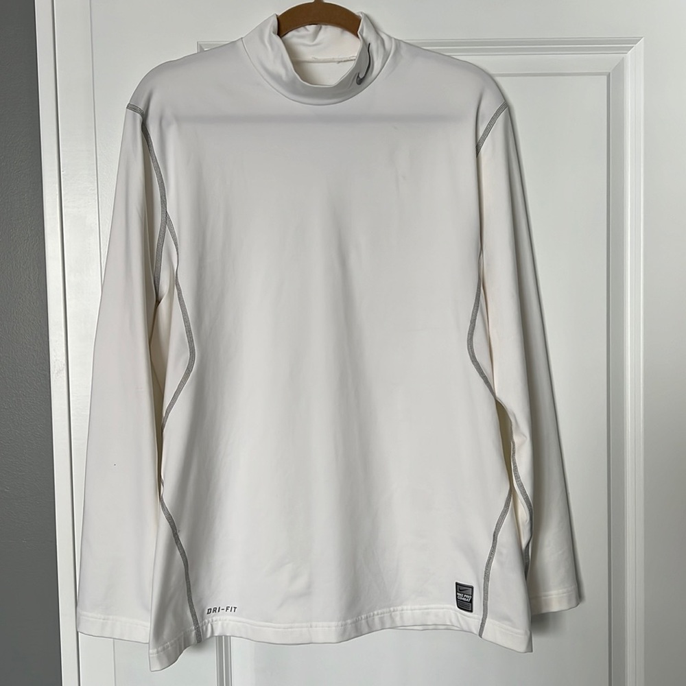 Nike mock turtleneck long sleeve golf shirt.
